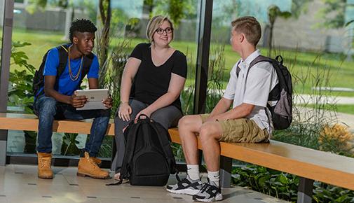 Three students talking in the Science Center